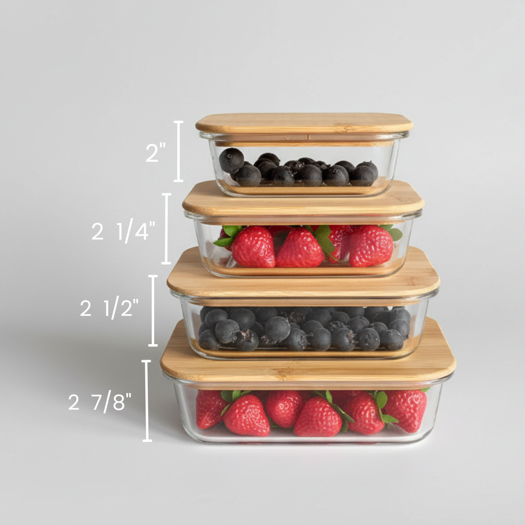 Stack of four glass food storage containers with bamboo lids, showing height measurements ranging from 2 inches to 2 7/8 inches, filled with blueberries and raspberries