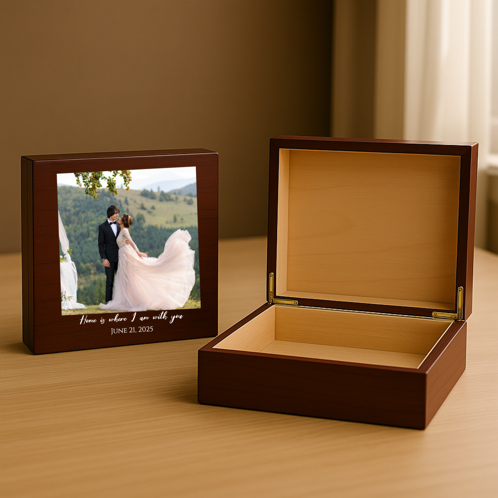 Dark wood keepsake box shown open to reveal tan interior storage space, and closed with sample wedding photo and engraved text "Home is where I am with you JUNE 21, 2025