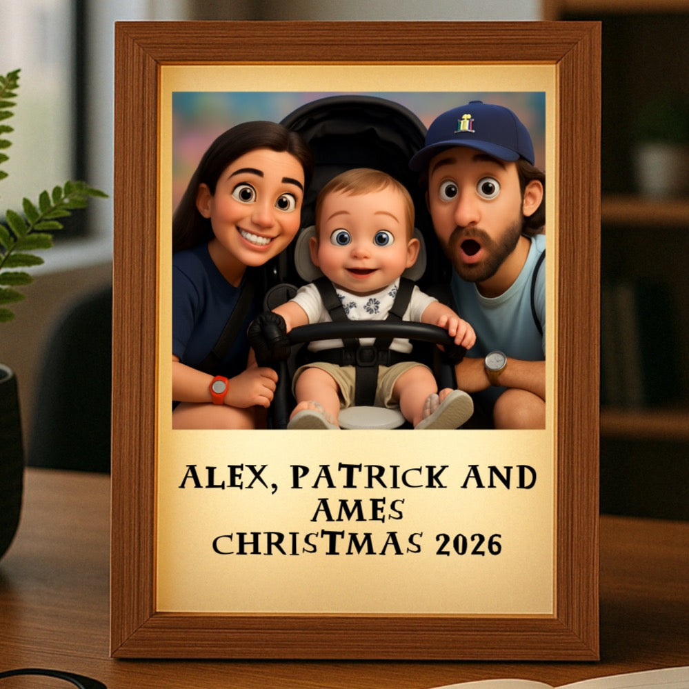 Wood-framed light box displaying animated family portrait with sample text "ALEX, PATRICK AND AMES CHRISTMAS 2026" below the image