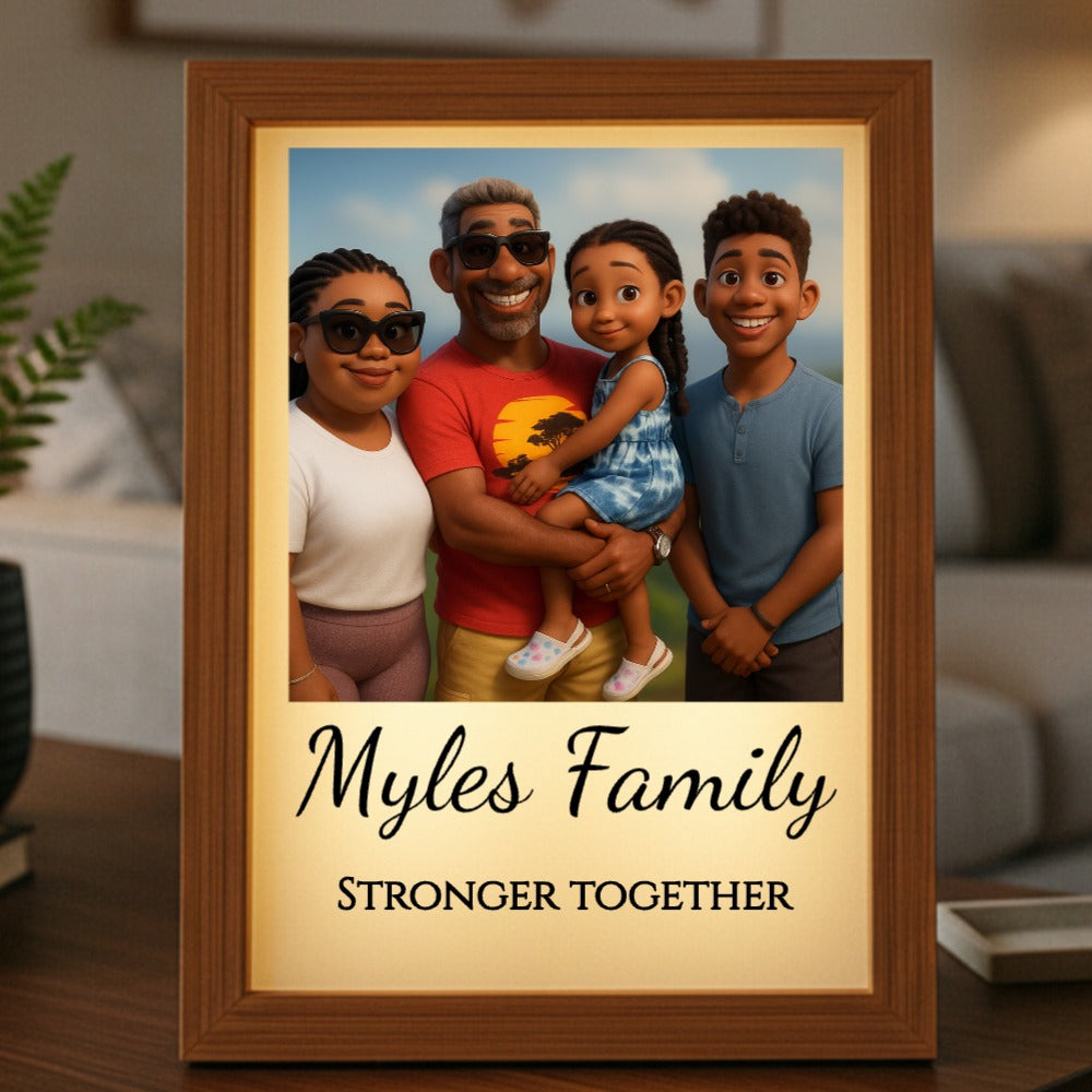 Wooden-framed light box displaying a cartoon-style family portrait with sample text "Myles Family" and "STRONGER TOGETHER" engraved on the cream-colored mat below the image
