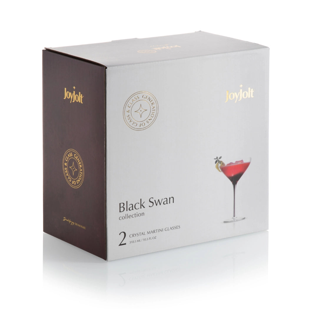 JoyJolt Black Swan collection packaging box showing two crystal martini glasses with red cocktail and product details on white and brown exterior