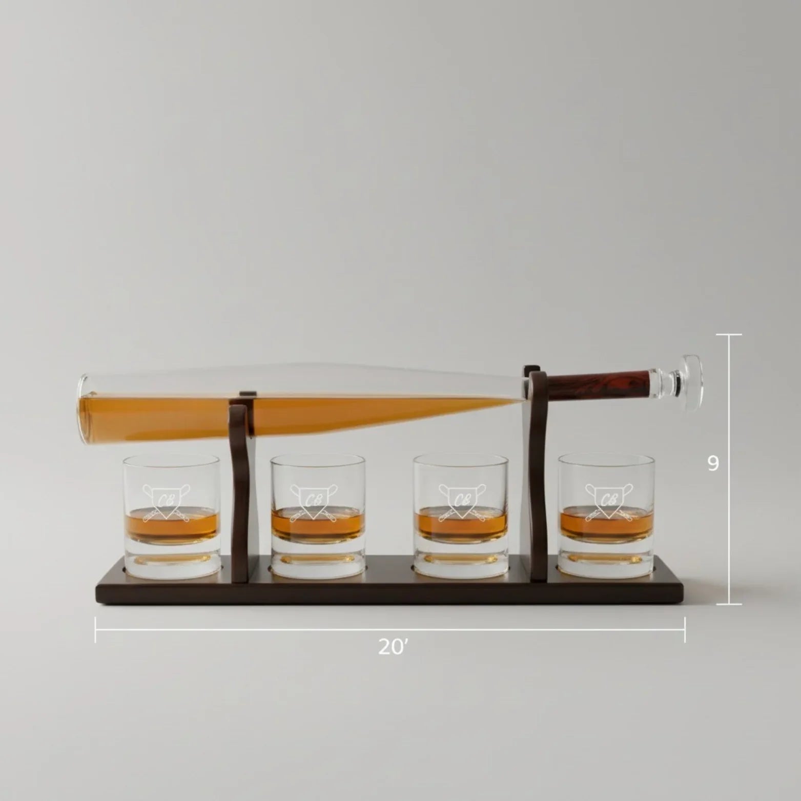 Whiskey decanter set with bat-shaped glass decanter and four glasses with baseball diamond bases, shown with dimension measurements of 20 inches wide by 9 inches tall