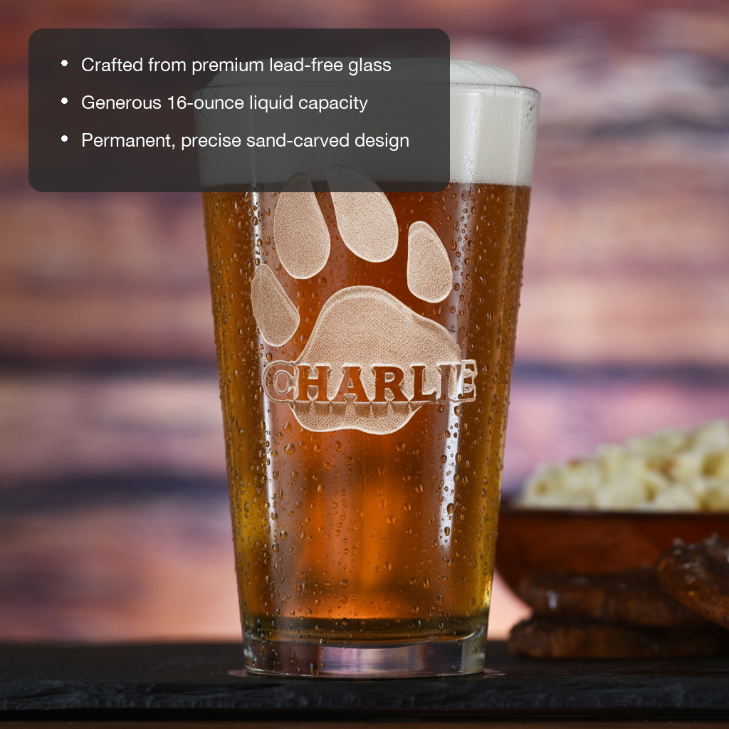 Paw Print Personalized Pint Glass features showing premium lead-free glass, 16 oz capacity, and permanent sand-carved design
