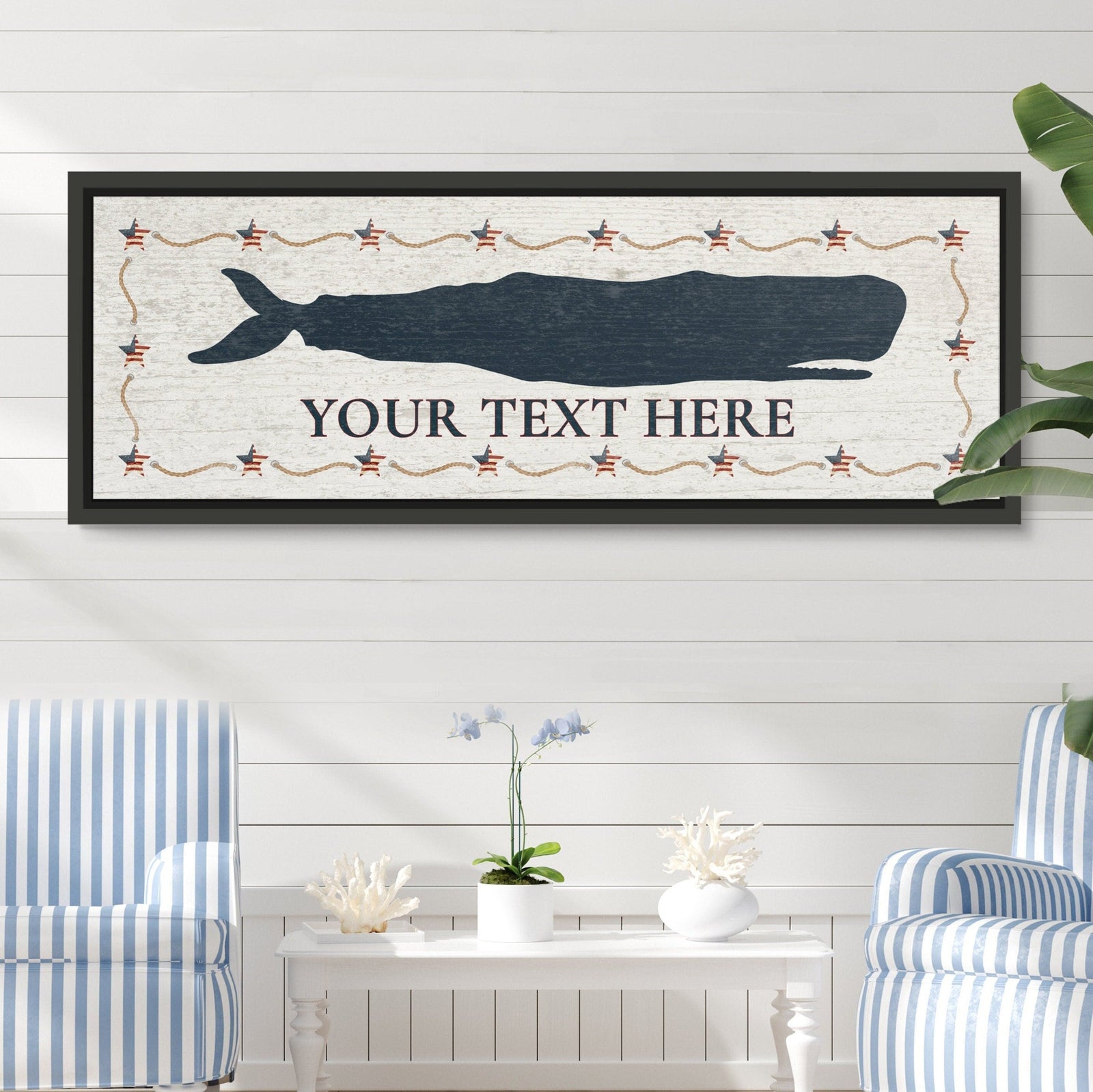Framed whale canvas sign with dark blue whale silhouette, decorative star and rope border, and customizable text area reading "YOUR TEXT HERE" on distressed white background