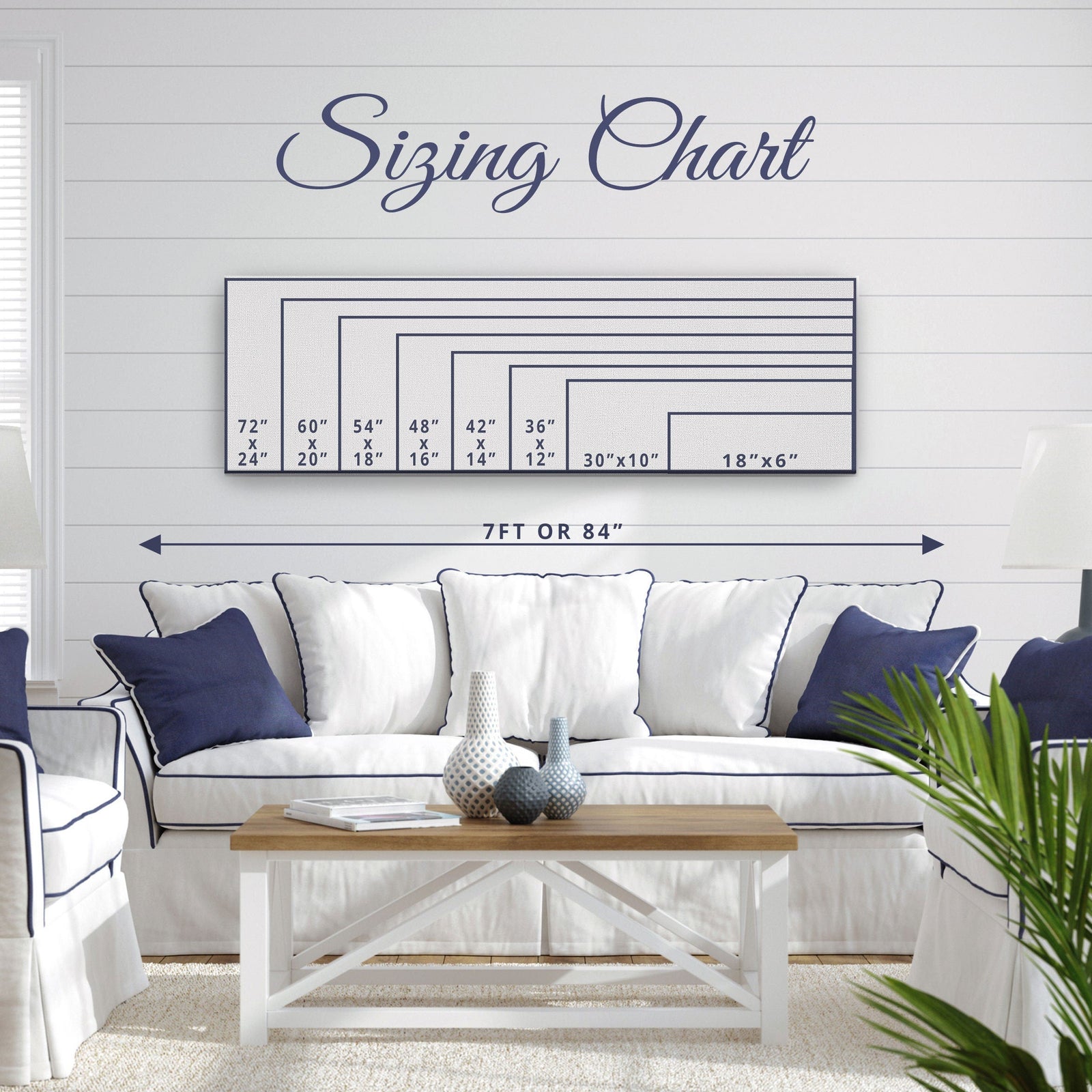 Sizing chart displaying eight canvas dimensions from 18"×6" to 72"×24", with 7 ft or 84" width reference shown above a styled living room with white sofa and wood table