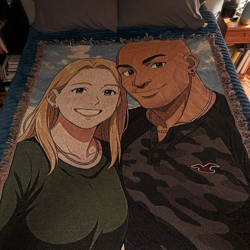 Personalized woven blanket with illustrated portrait of two people against a blue background, framed by woven fringe border