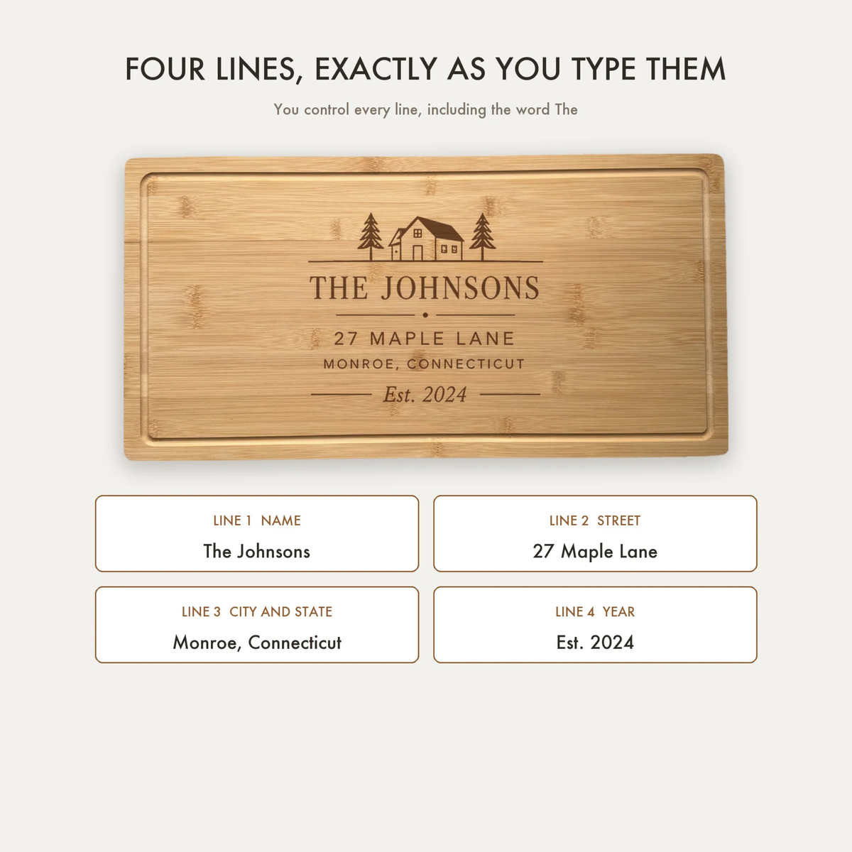 Wooden charcuterie board with sample engraving showing "The Johnsons" name, address "27 Maple Lane, Monroe, Connecticut," and "Est. 2024" with house and tree design.