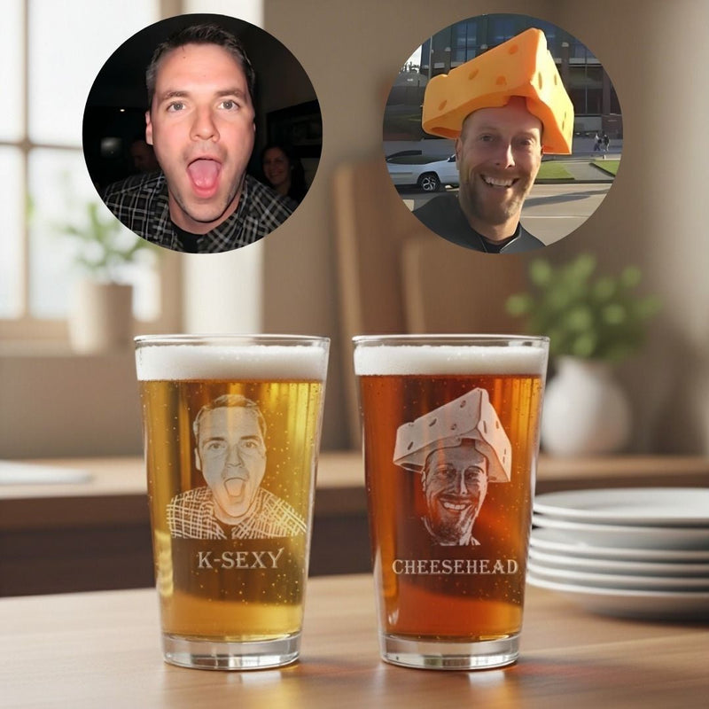 Two pint glasses filled with beer, each laser-engraved with sample portrait photos and text reading "K-SEXY" and "CHEESEH3AD," displayed on a wooden table with circular photo previews above showing customization examples.