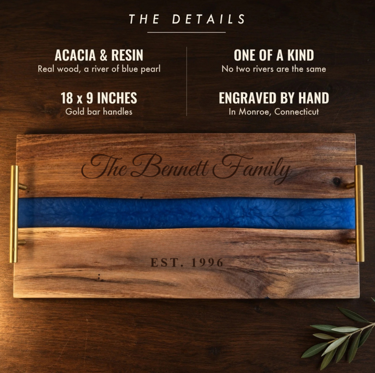 The details of the Blue River Serving Tray: acacia and blue pearl resin, one of a kind, 18 by 9 inches with gold handles, engraved The Bennett Family EST. 1996