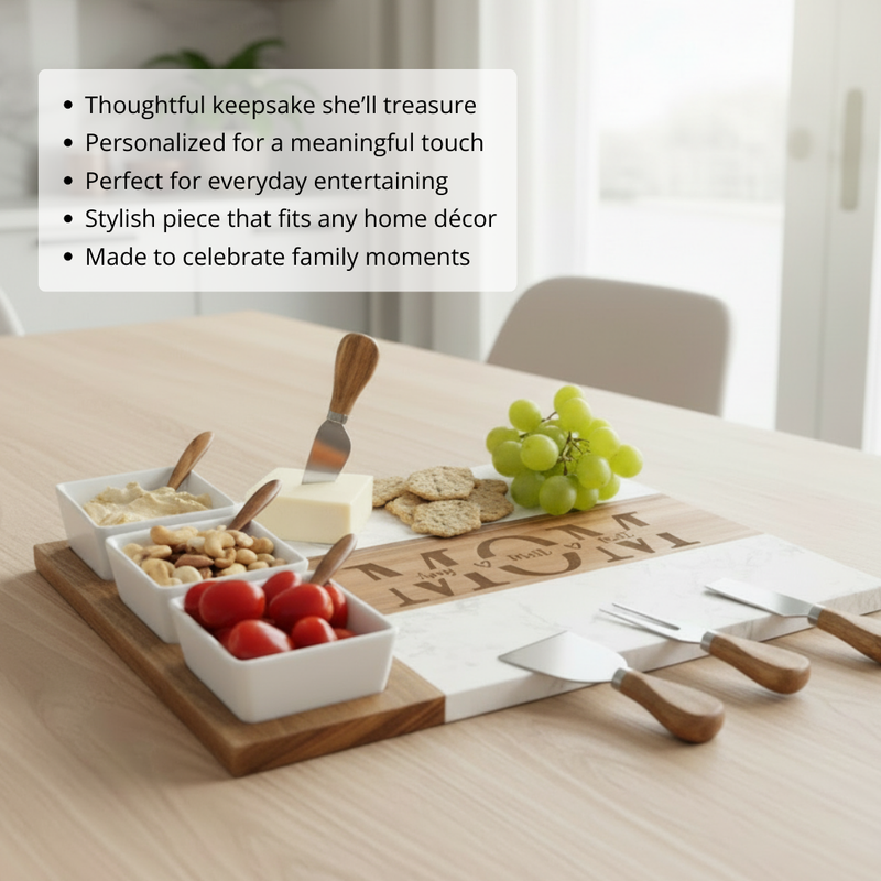 Personalized charcuterie board with sample names engraved in a circle around "MOM," styled with ceramic bowls, wooden spoons, cheese knives, and appetizers on a dining table