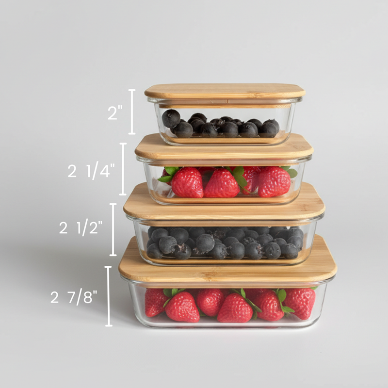 Stack of four glass food storage containers with bamboo lids, showing height measurements ranging from 2 inches to 2 7/8 inches, filled with blueberries and raspberries