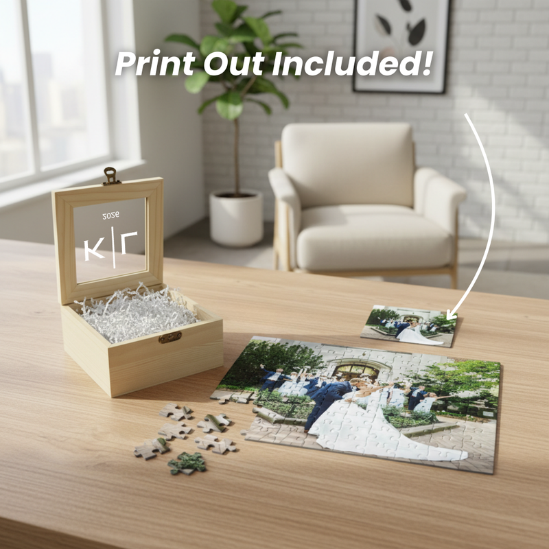 Wooden puzzle box with sample engraving "sose" and "klr" on lid, open to reveal shredded tissue inside, displayed with completed photo puzzle and loose puzzle pieces on wood table.