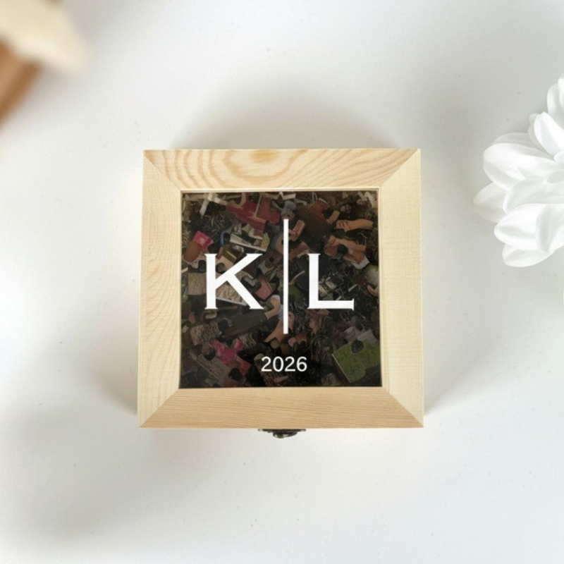 Natural wood frame with light finish displaying sample initials "K" and "L" with year "2026" over a photo collage background