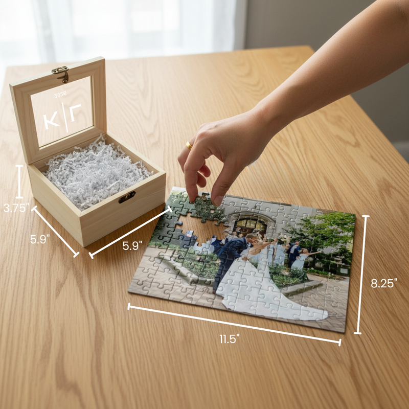 Natural wood box with personalized photo puzzle showing wedding photo, hand placing puzzle piece, with dimensions labeled 5.9" x 3.75" x 5.9" for box and 11.5" x 8.25" for puzzle