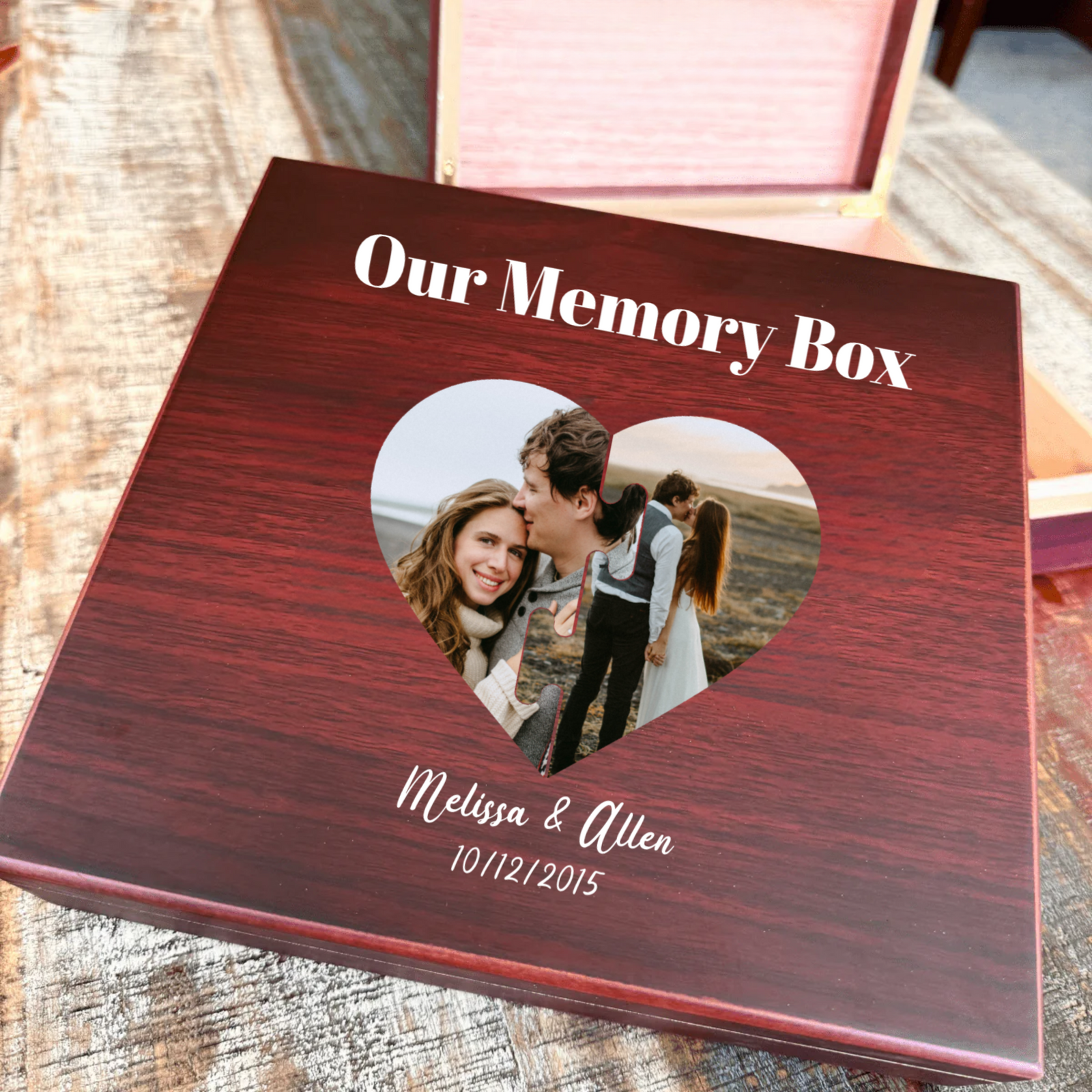 Dark wood memory keepsake box with heart-shaped photo window displaying sample photo, engraved with sample names "Melissa & Allen" and date "10/12/2015