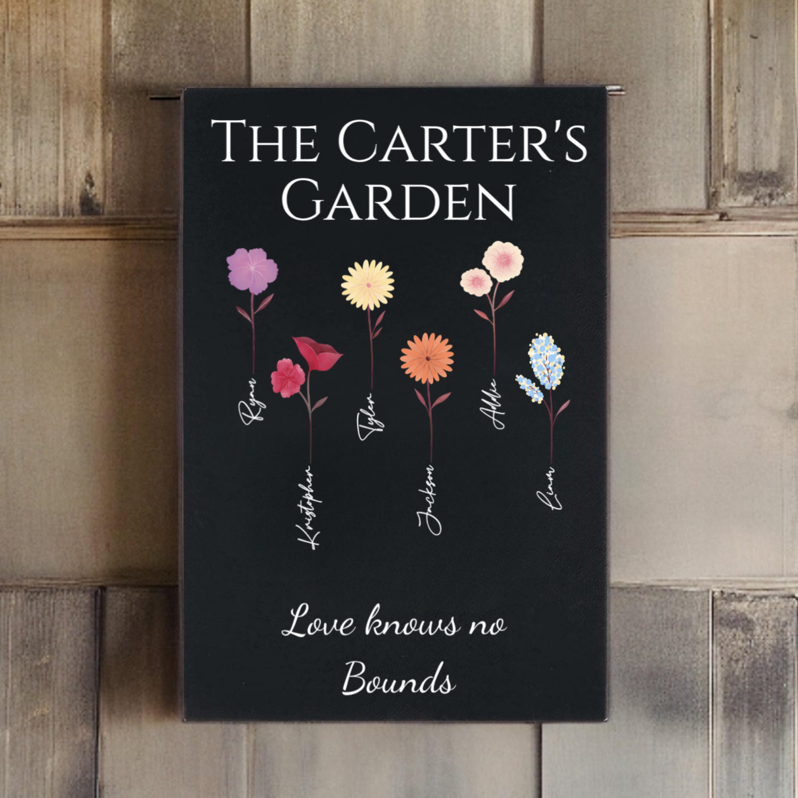 Personalized family garden canvas with four colorful birth flowers and custom names in script on black leatherette background