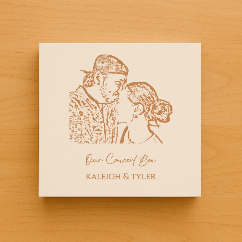 Cream-colored keepsake box with laser-engraved portrait of two people and text reading "Our Concert Box" and sample names "KALEIGH & TYLER