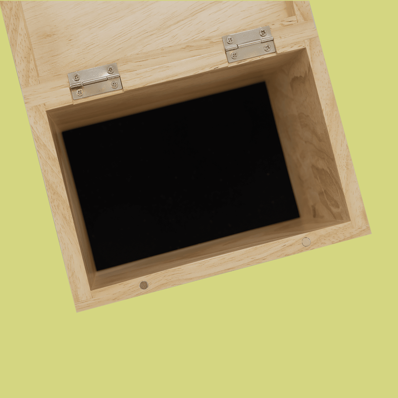 Open wooden recipe box with natural finish, silver hinges, and black felt-lined interior for holding standard recipe cards