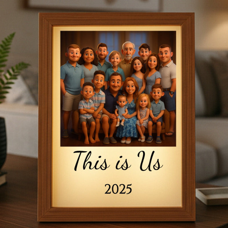 Wood-framed light box displaying animated family portrait with sample text "This is Us" and "2025" printed on cream mat below image