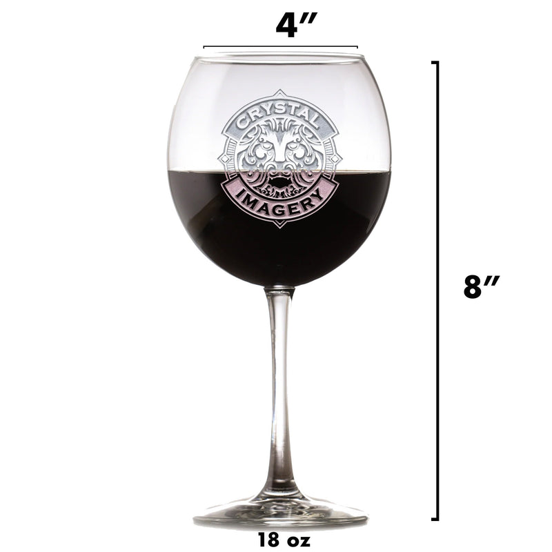 Engraved wine glass showing "Crystal Imagery" lion crest design, 8 inches tall and 18 ounces, filled with dark red wine to demonstrate capacity