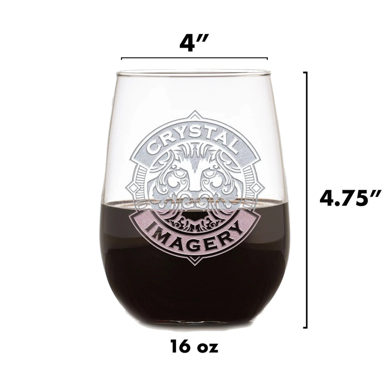 Clear stemless wine glass with sand-carved oval design featuring sample text "CRYSTAL" and "IMAGERY" with decorative flourishes, filled with dark liquid, dimensions marked as 4" wide and 4.75" tall