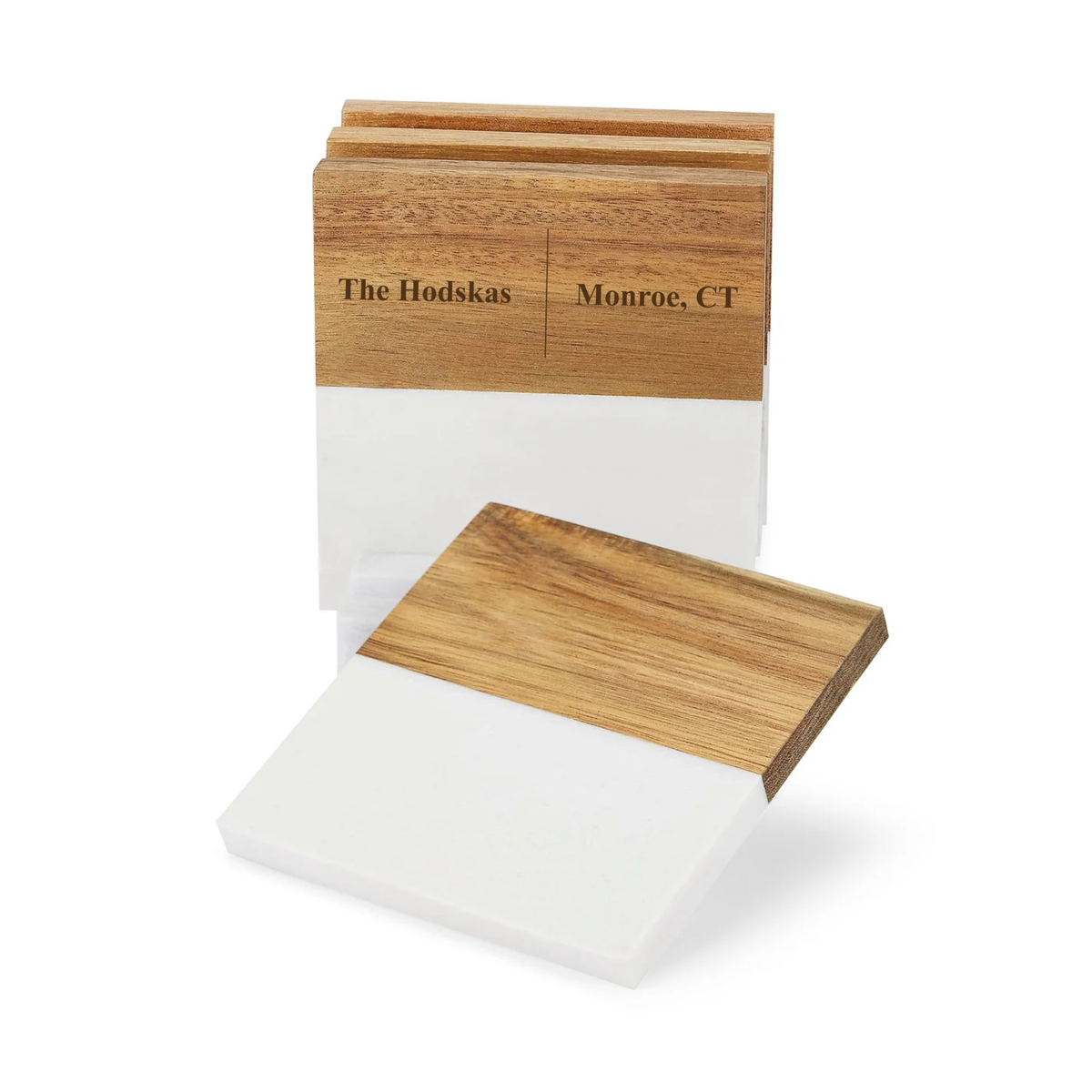 Wooden coaster set with sample personalization reading "The Hodskas" and "Monroe, CT" engraved on top surface, shown with one coaster displayed separately