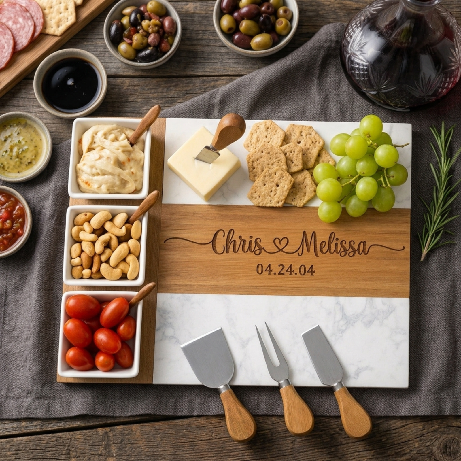 Personalized anniversary charcuterie board engraved with both names and a heart, styled with cheese, crackers, and grapes. 