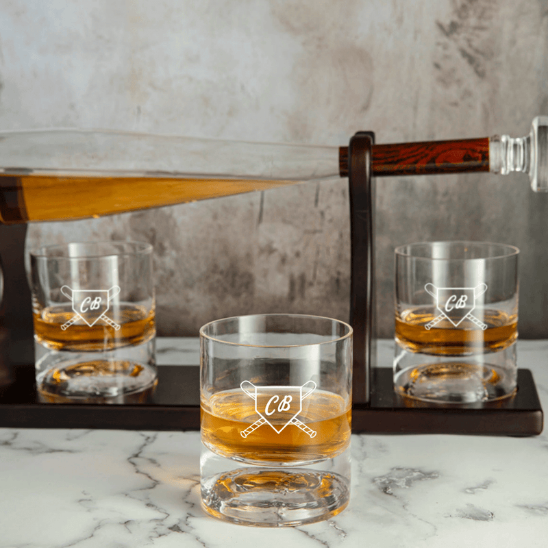 Baseball bat-shaped whiskey decanter set with matching glasses and mahogany holder