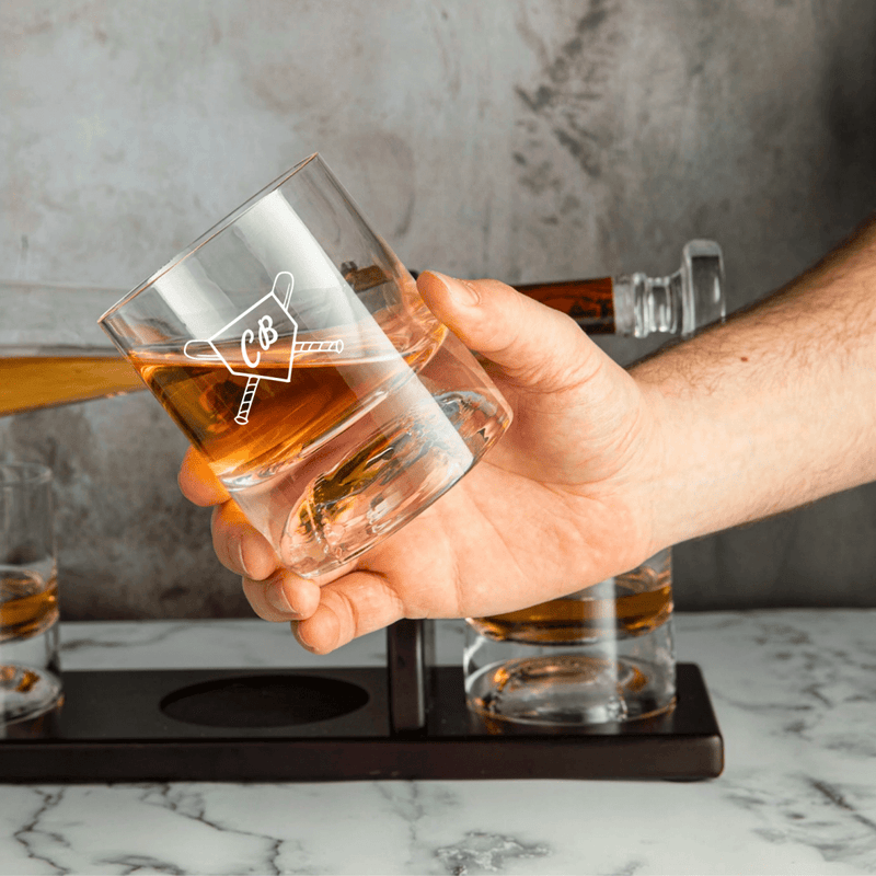 Baseball bat-shaped whiskey decanter set with matching glasses and mahogany holder