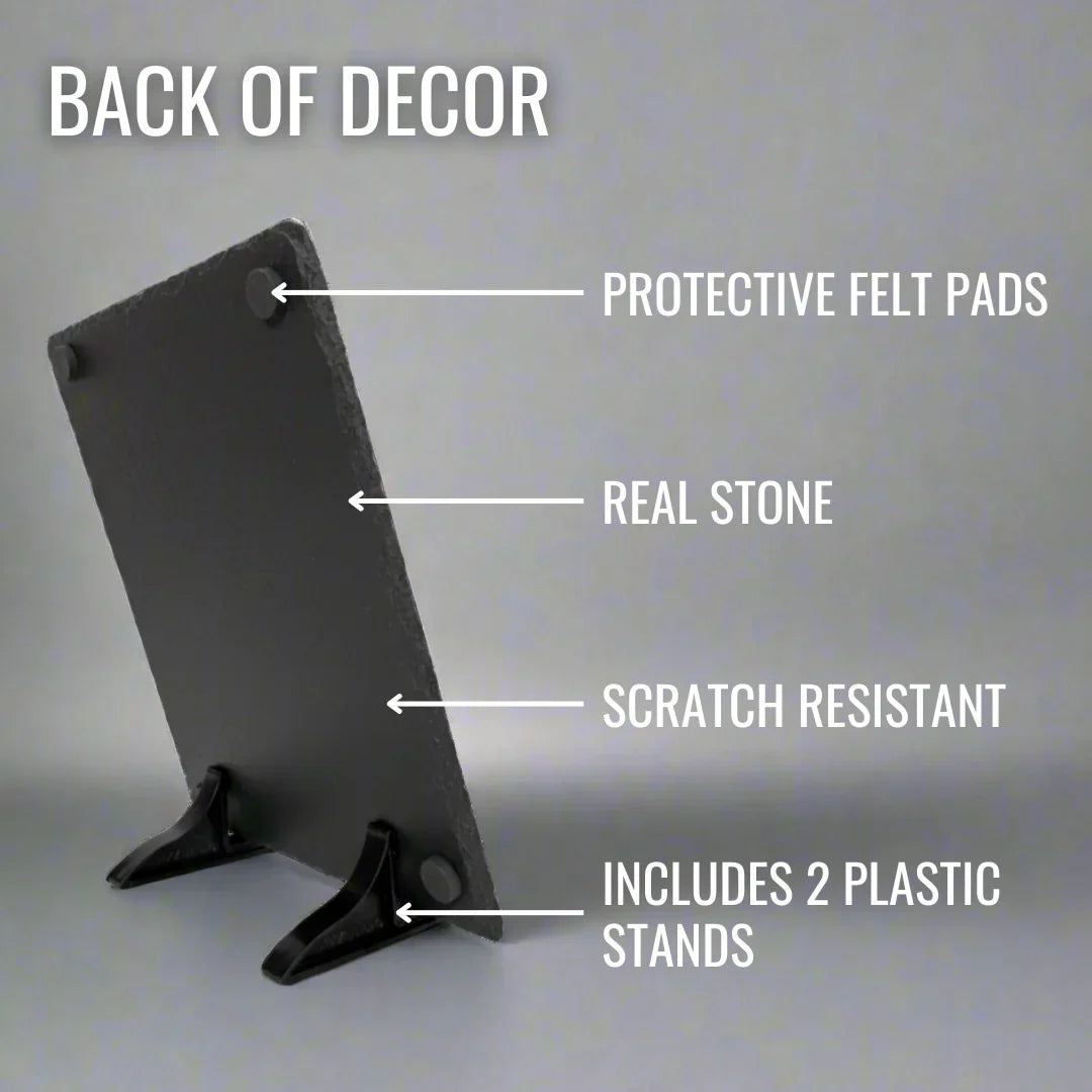 Back view of black slate plaque showing protective felt pads at top corners, real stone surface, scratch-resistant finish, and two black plastic display stands included at base