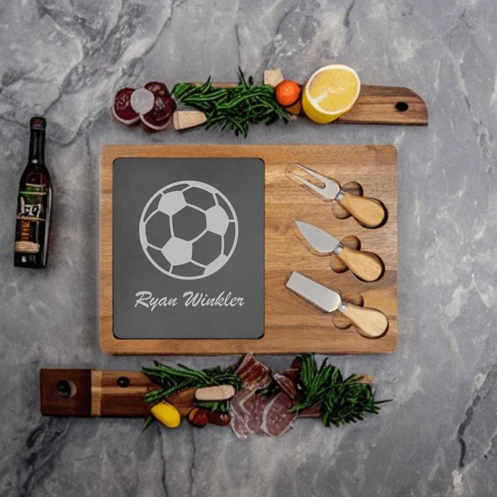 Personalized Soccer Charcuterie Board engraved with a soccer ball and a custom name on a slate and acacia wood board with cheese knives
