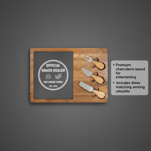 Charcuterie board with slate and acacia wood showing sample engraving "Official Snack Dealer" with matching cheese knives and serving utensils displayed alongside