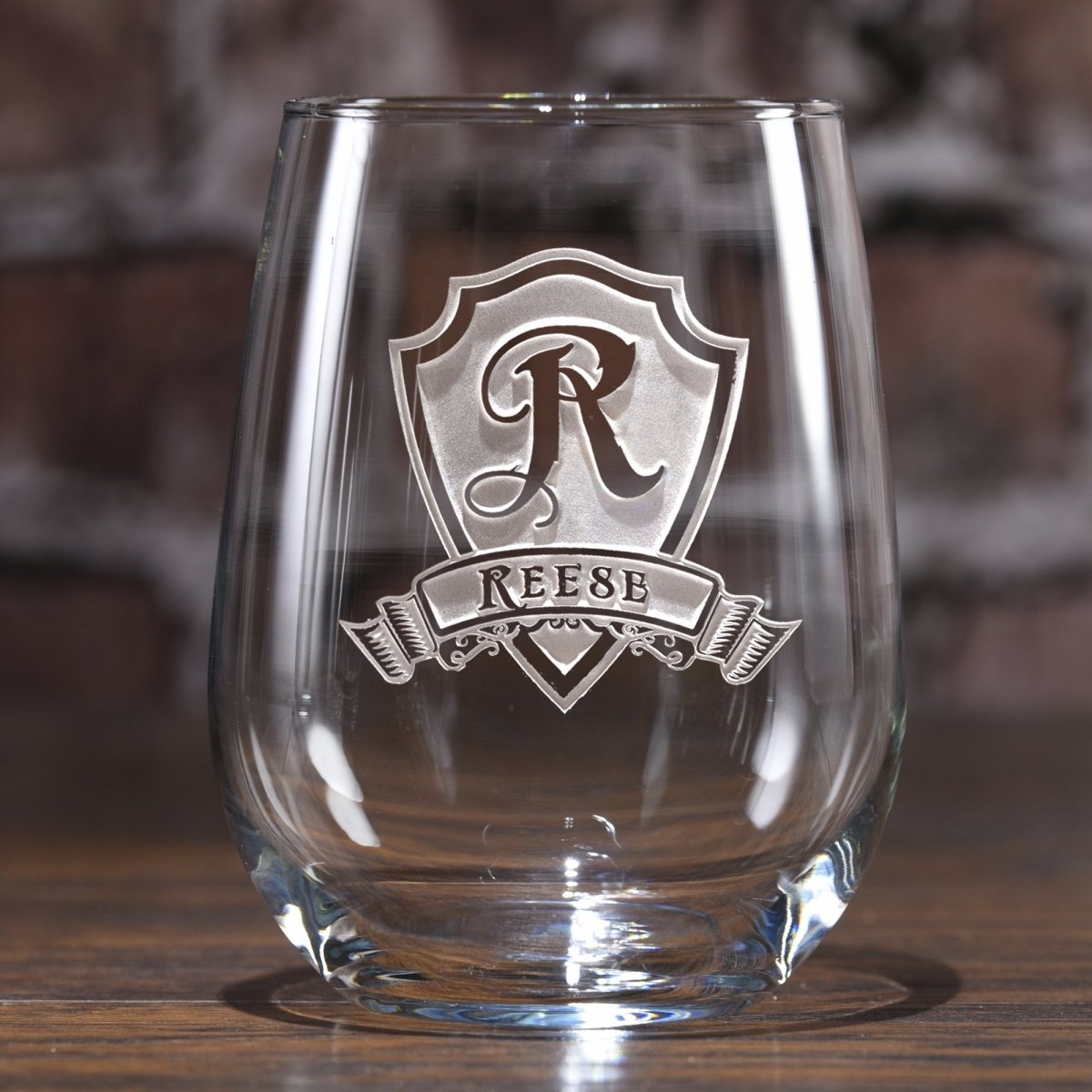 Heritage Crest Stemless Wine Glass with raised shield monogram and custom name