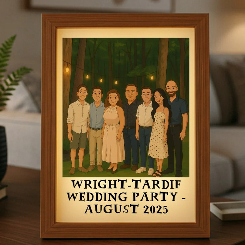 Framed personalized 2D cartoon portrait showing seven illustrated people standing in a forest setting with hanging lights, customized with sample names "WRIGHT-TARDIF WEDDING PARTY - AUGUST 2025" printed below the image in a wood frame with warm LED lighting