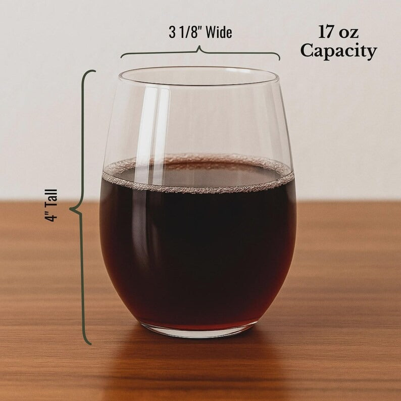 Clear stemless wine glass filled with dark red wine, showing 17 oz capacity and 3 1/8" wide opening with 4" tall measurement indicators on the side.