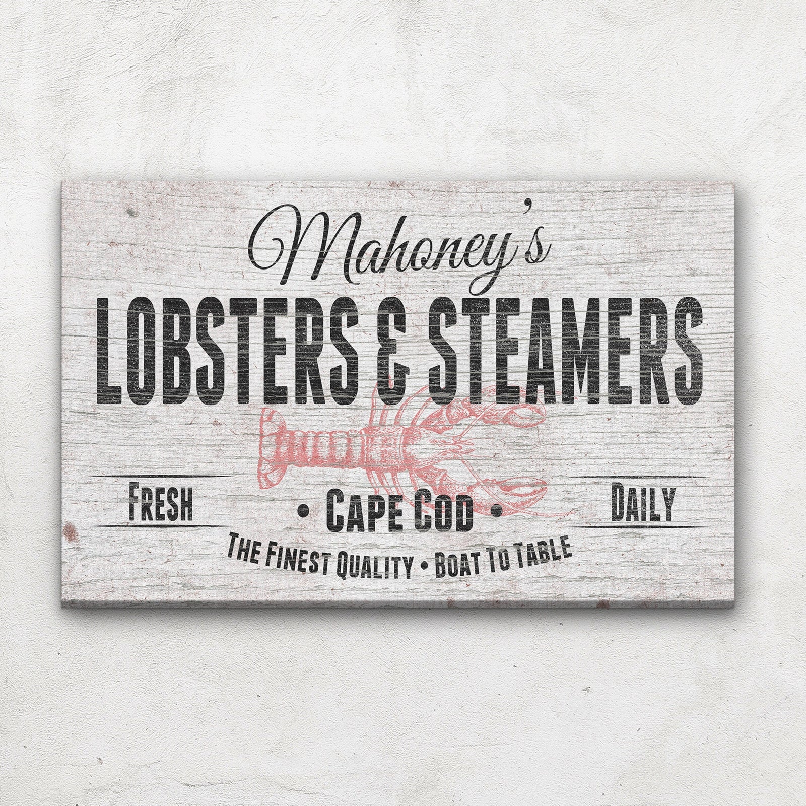 Lobster Shack Canvas showing "Mahoney's" in black script above bold "Lobsters & Steamers" lettering with a pink lobster illustration and "Fresh · Cape Cod · Daily" on a distressed white wood background, mounted on a shiplap wall