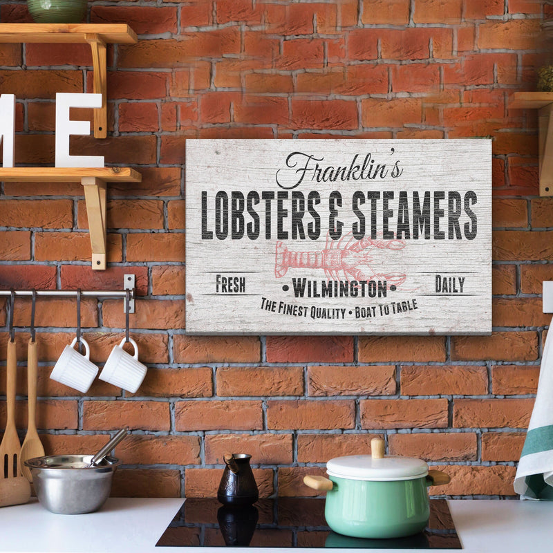 Personalized lobster shack sign with sample name "Franklin's" and location "Wilmington" displayed on exposed brick wall above kitchen counter