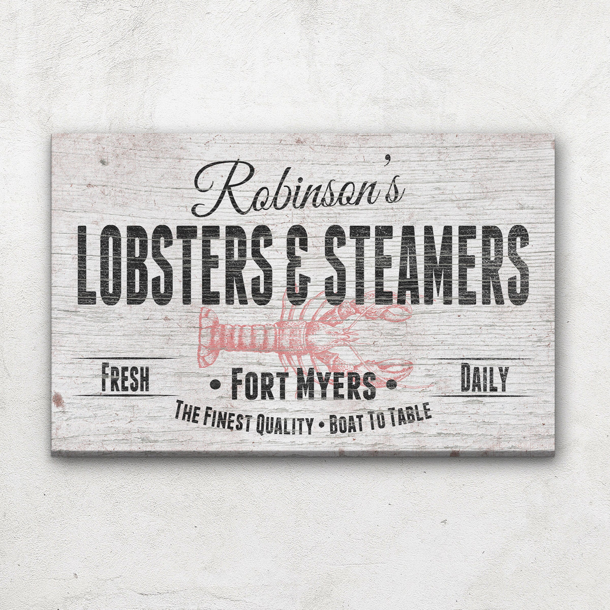Personalized canvas sign with sample name "Robinson's" at top, "Lobsters &amp; Steamers" in bold text, red lobster illustration, and "Fort Myers" location text on distressed white wood background.