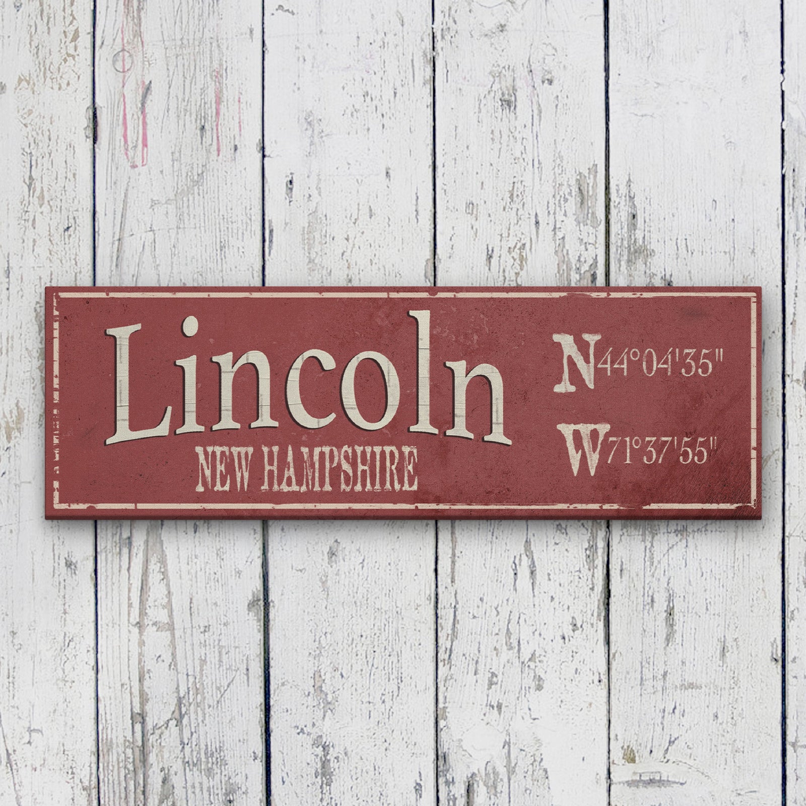 Personalized Hometown Canvas displaying "Myrtle Beach" in large cream serif lettering with "South Carolina" in caps below, alongside stacked N and W GPS coordinates on the right side, all on a distressed dusty blue background with a cream painted border frame, mounted on a shiplap wall above a rustic bench with lantern