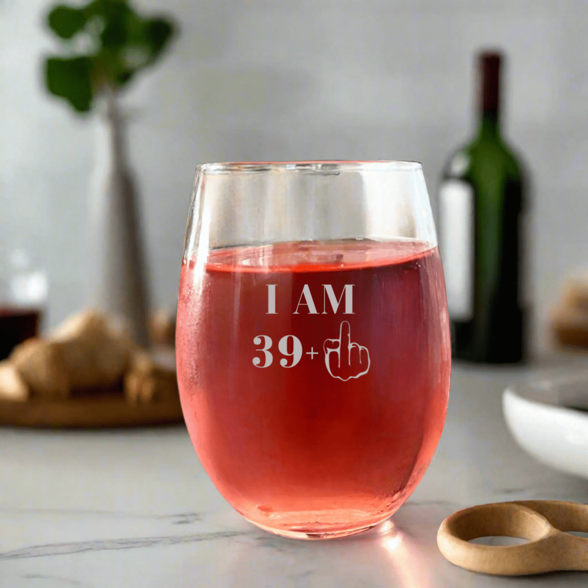 Personalized Stemless wine glass with I AM 39+ design on kitchen counter - Willow And Hive 
