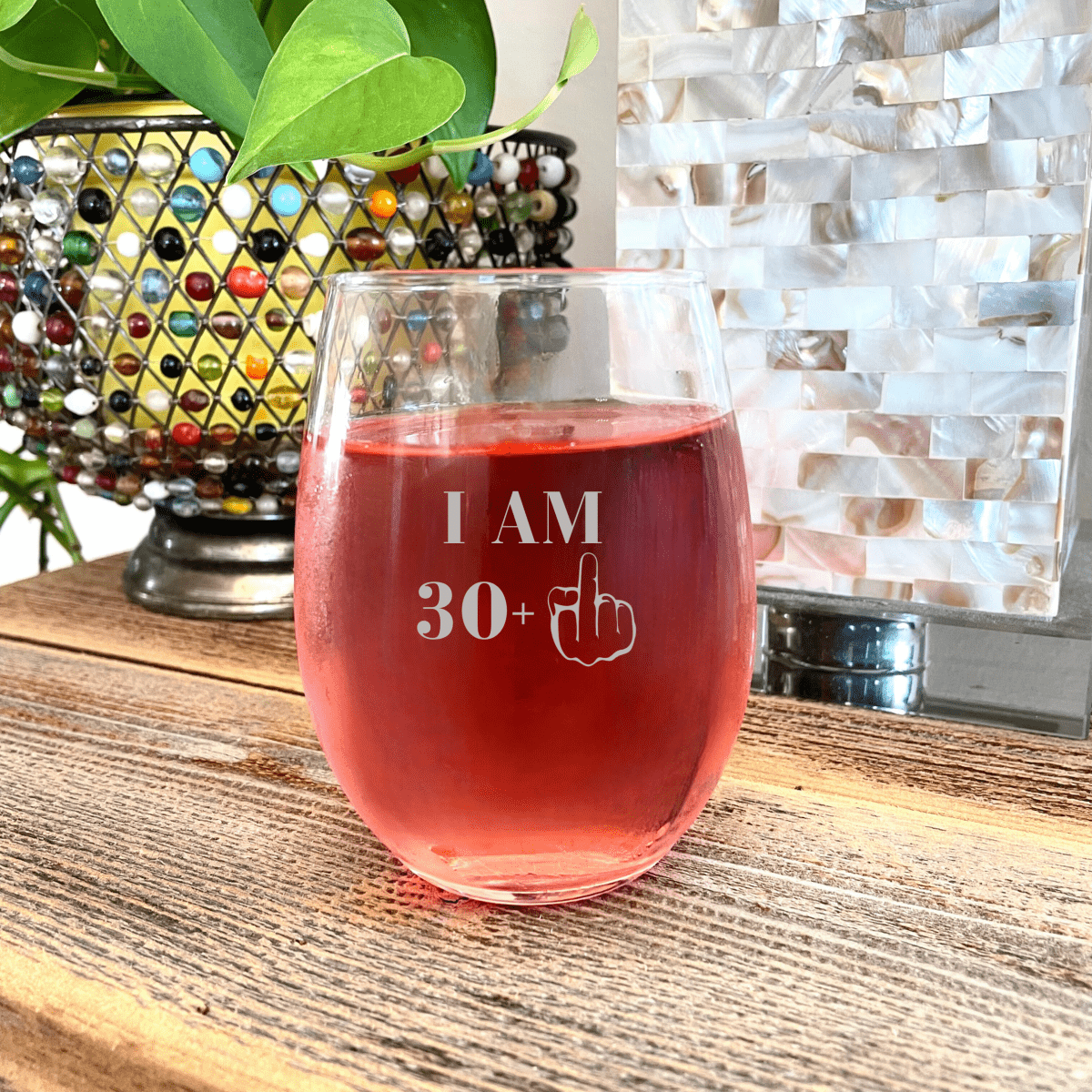 Personalized Stemless wine glass with I AM 39+ design on kitchen counter - Willow And Hive 