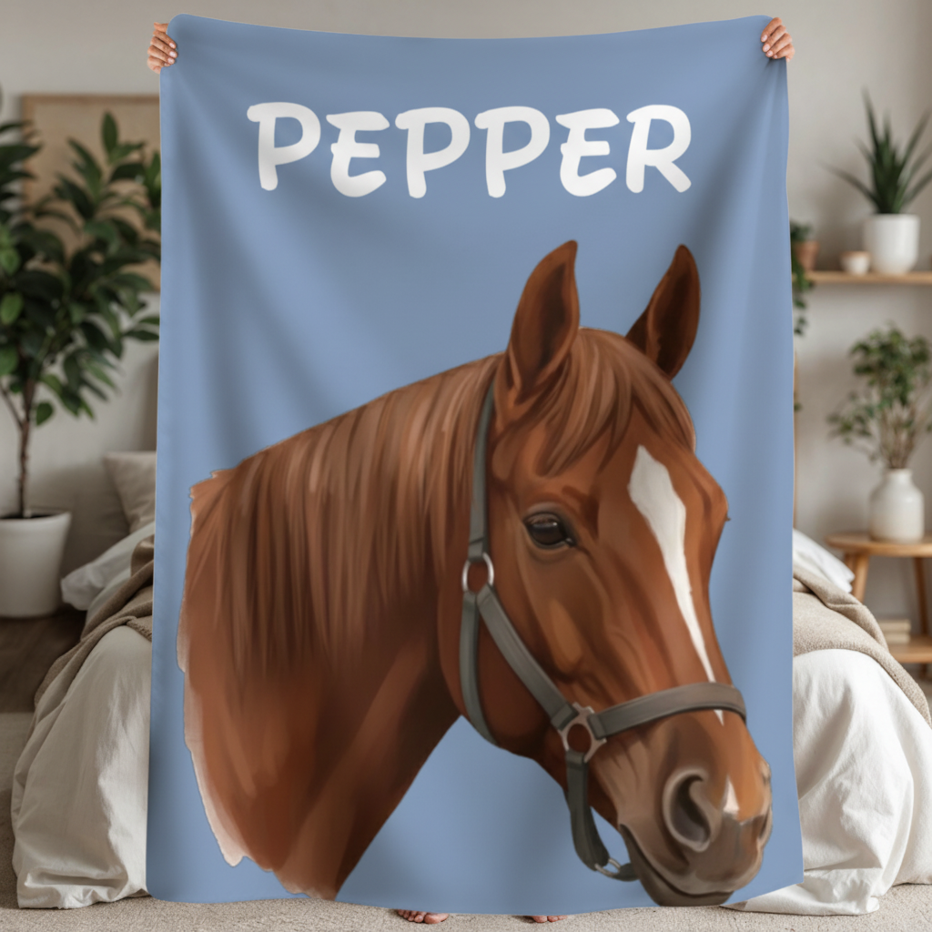 Blue sherpa blanket printed with cartoon portrait of brown horse wearing halter, with sample name "PEPPER" in white lettering at top