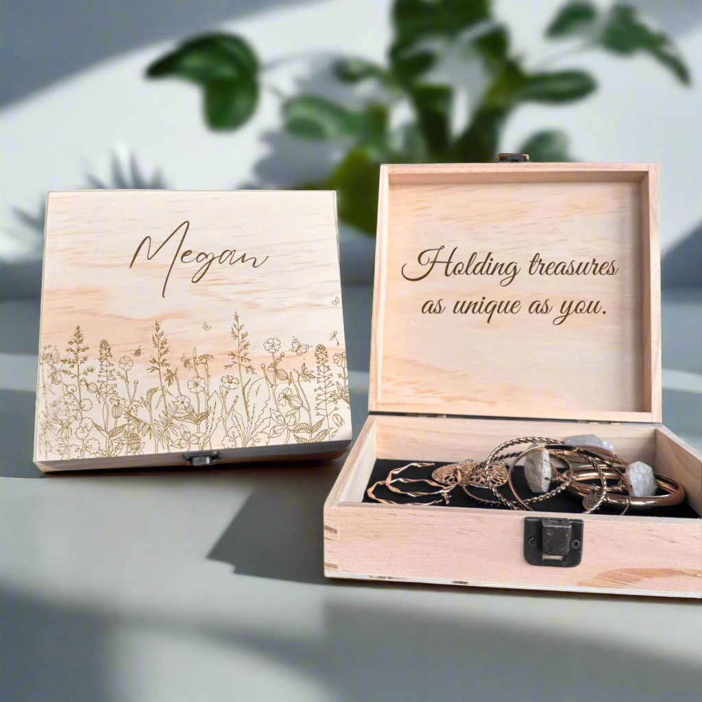 Personalized wildflower engraved wooden keepsake box open to reveal custom message inside lid, with jewelry stored inside on black felt lining