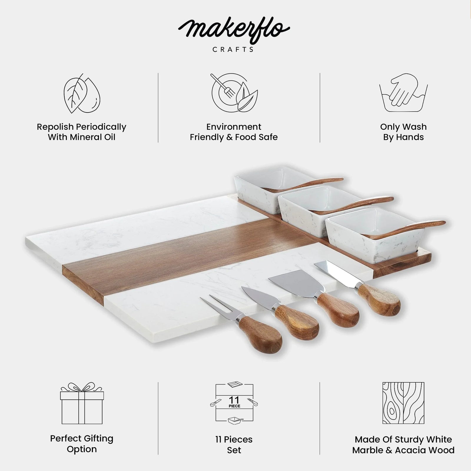 Eleven-piece charcuterie set featuring white marble and acacia wood board with three ceramic bowls and four serving utensils with wooden handles