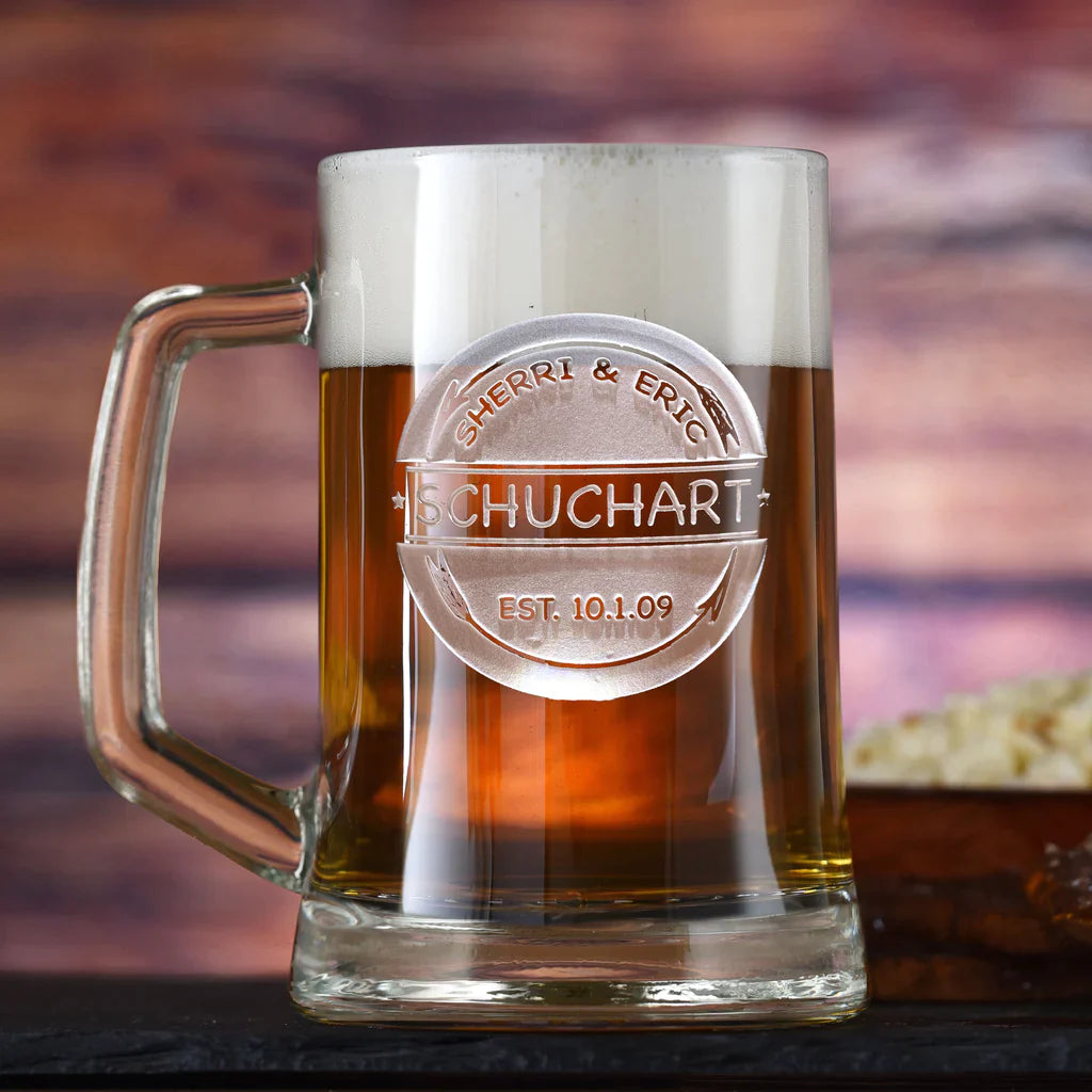 Glass beer mug filled with beer, engraved with sample names "SHERRI &amp; ERIC" and "SCHUCHART" with date "EST. 10.1.09" in circular banner design