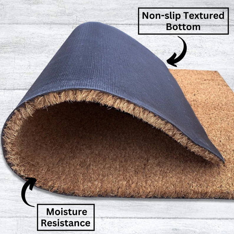 Navy blue and cork door mat rolled to show non-slip textured rubber backing and moisture-resistant underside construction