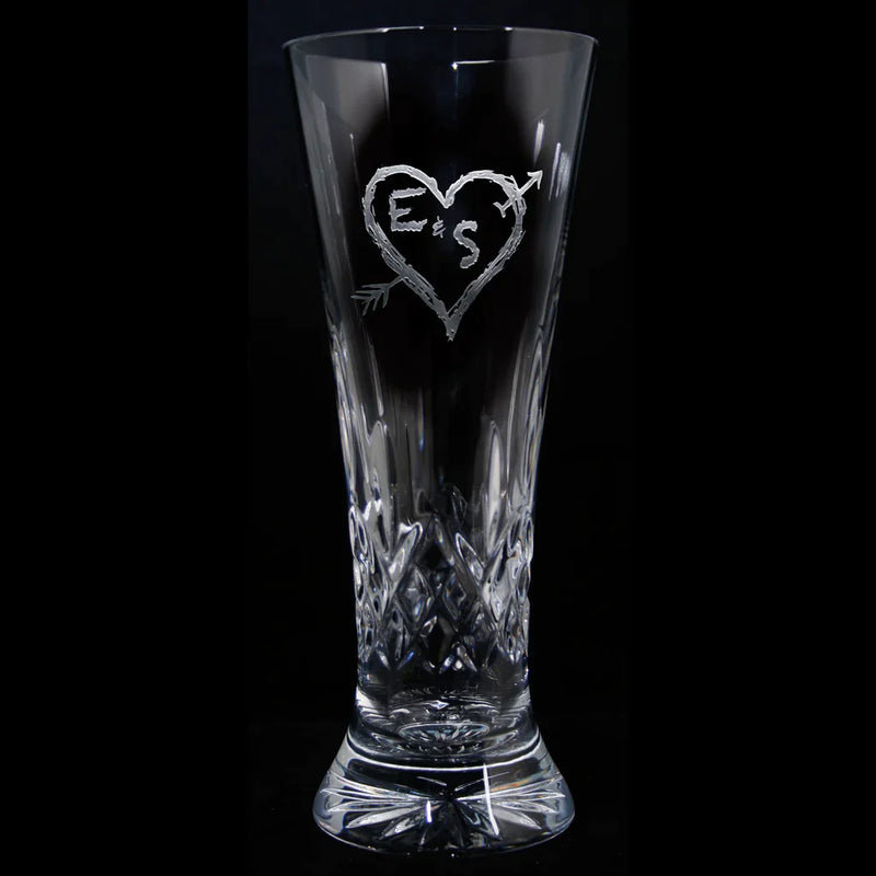 Waterford Lismore crystal pilsner with engraved sample heart and arrow design containing initials "E & S", diamond-cut pattern on lower half